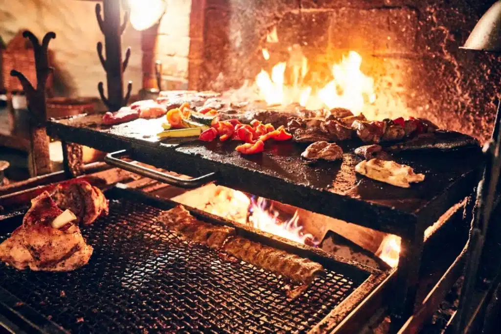 carnes cocinandose en la chimenea de una tipica borda andorrana 